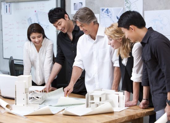 Chinese and western architects team working in studio